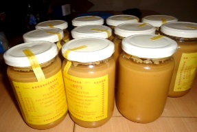 Handmade peanut butter ready for distribution.