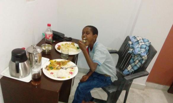 young-boy-in-ethiopia-smiles-as-he-eats-his-first-real-food-after-receiving-heart-surgery
